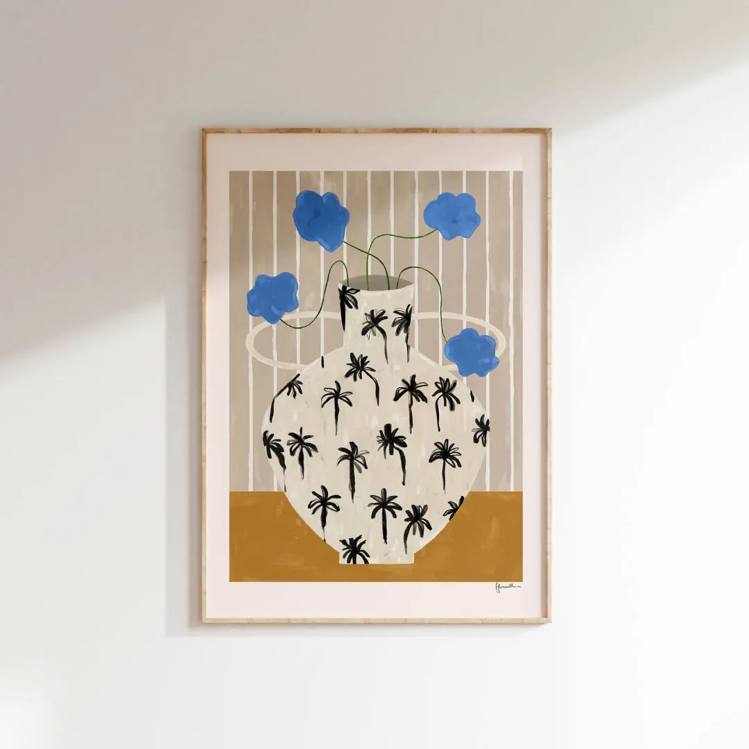 blue flowers in palm tree vase