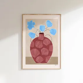 blue flowers in shell vase